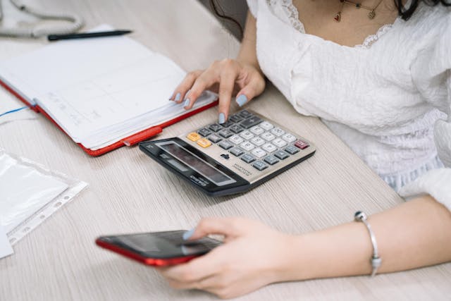 person%20doing%20math%20on%20a%20calculator